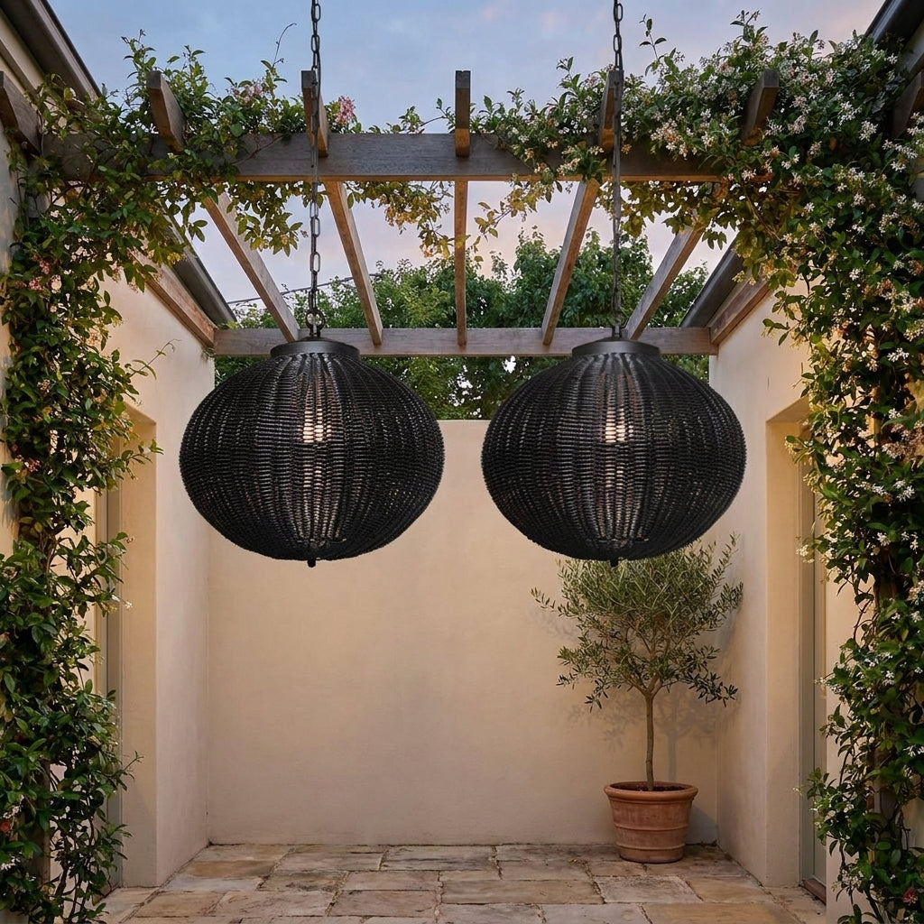 Black Rattan Outdoor Pendant Lantern – hanging pair from a pergola in a courtyard