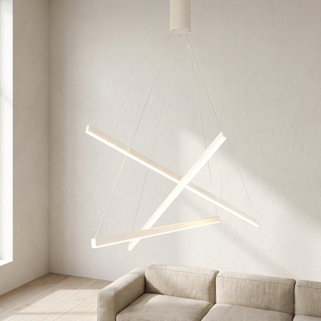 White Linear LED Chandelier – lit crossed light bars above a beige sofa