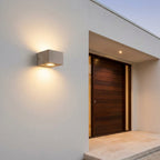 Concrete Outdoor LED Wall Light – mounted beside a dark wood front door