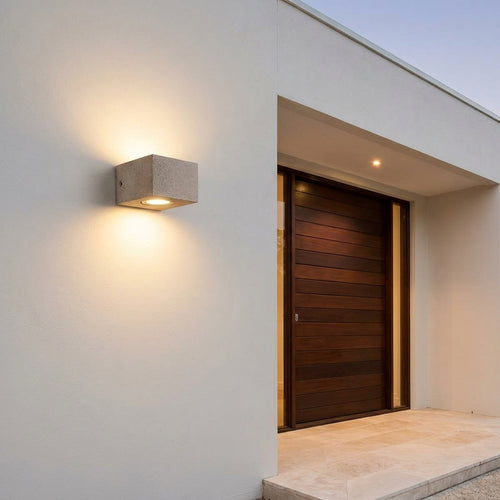 Concrete Outdoor LED Wall Light – mounted beside a dark wood front door