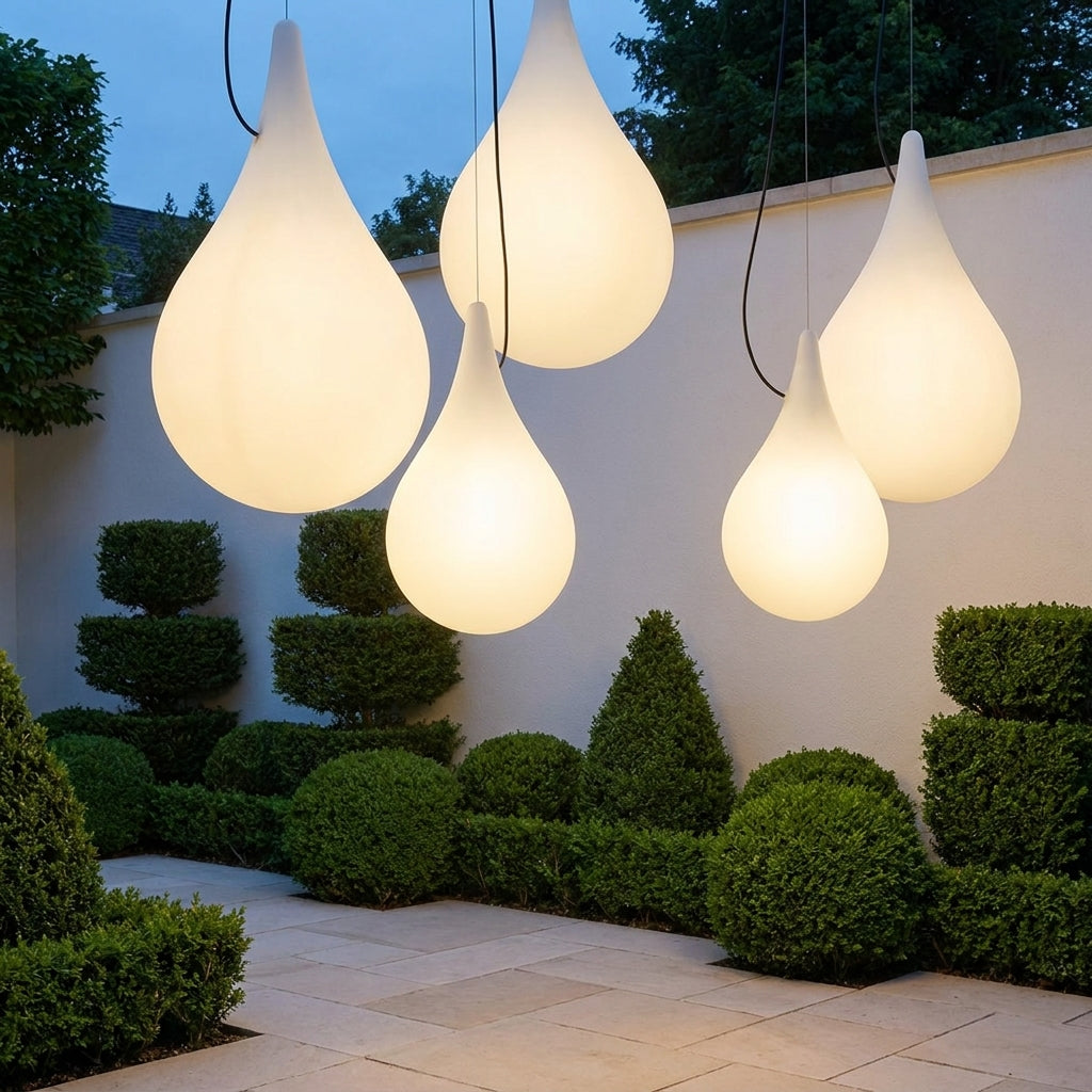 Water Drop Outdoor Pendant Light – five drop pendants lit above a garden patio