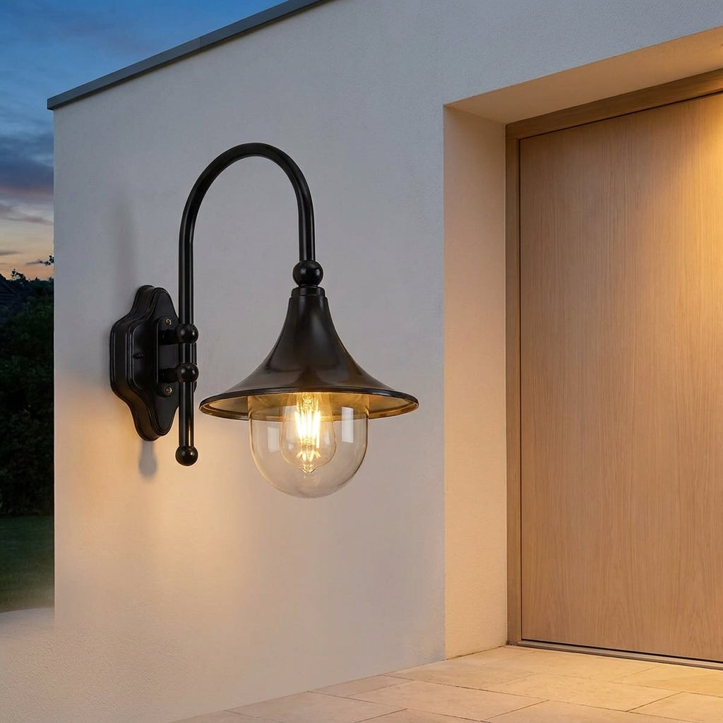 Farmhouse Horn Outdoor Wall Light – lit beside a front door at dusk