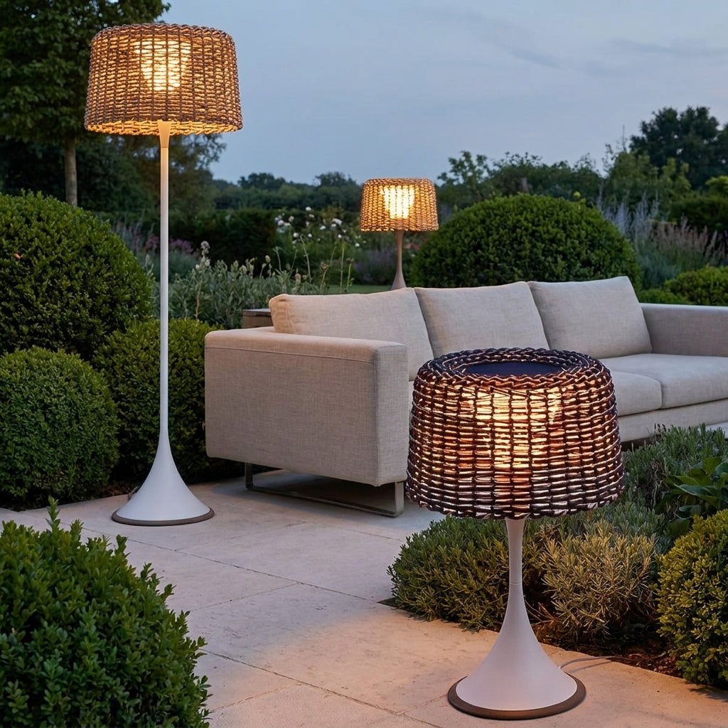 Woven Solar Outdoor Floor Lamp – lit outdoor scene beside a sofa at dusk