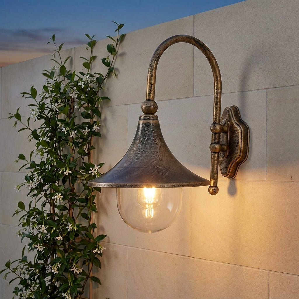 Farmhouse Horn Outdoor Wall Light – on a stone wall beside jasmine at dusk