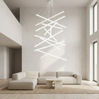 White Linear LED Chandelier – lit crossed bars in a tall living room