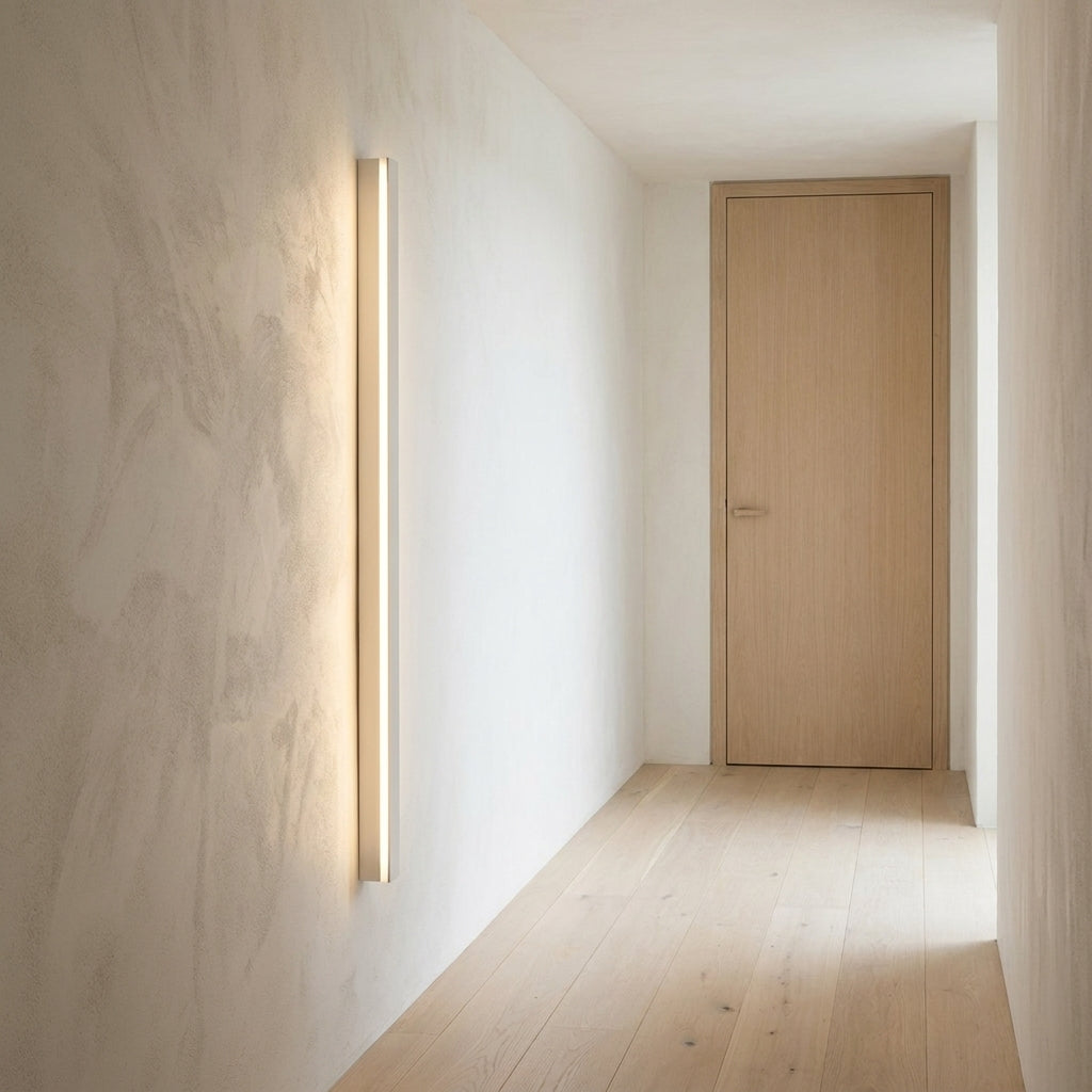 Wooden Up & Down LED Wall Light – lit on a hallway wall beside a door