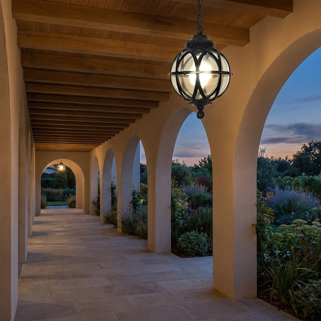 Outdoor Glass Ball Chandelier – hanging under a covered walkway at dusk