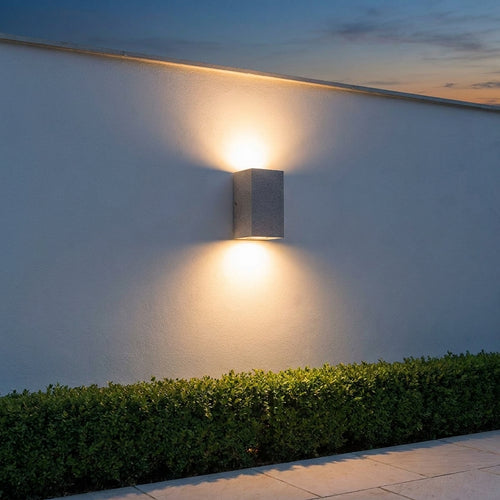 Concrete Outdoor LED Wall Light – mounted on a garden wall at dusk