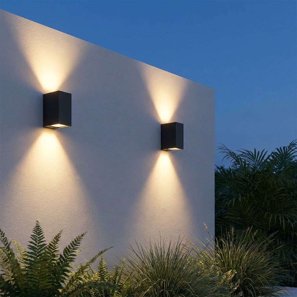 Square Outdoor Up & Down Wall Light – two lights mounted on a white wall at dusk
