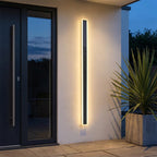 Solar LED Strip Porch Wall Light – lit beside a front door at dusk