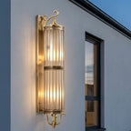 Mid Century Copper Outdoor Wall Lantern – mounted beside a window at dusk