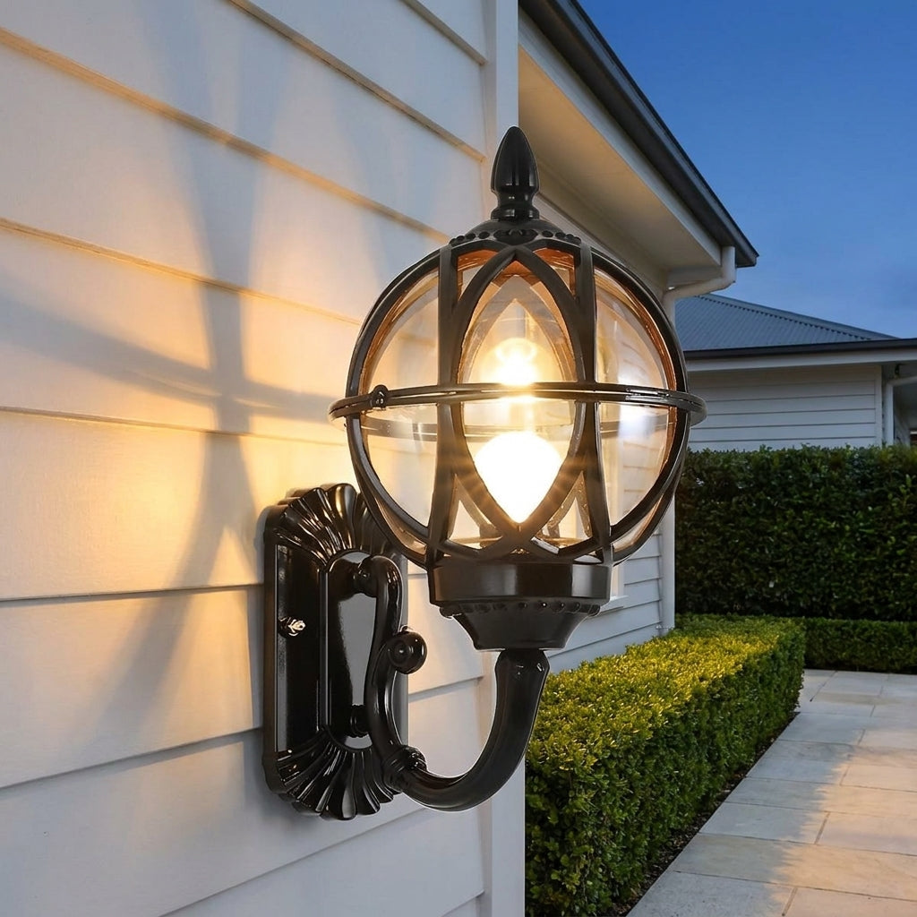 Bird's Nest Outdoor Wall Lantern – black finish on a weatherboard wall
