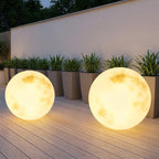 Solar Moon Ball Garden Lights – two moon lights glowing on a wooden deck