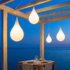 Water Drop Outdoor Pendant Light – four pendants lit above an outdoor dining table