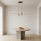 Linear LED Pendant Light – lit above a round dining table