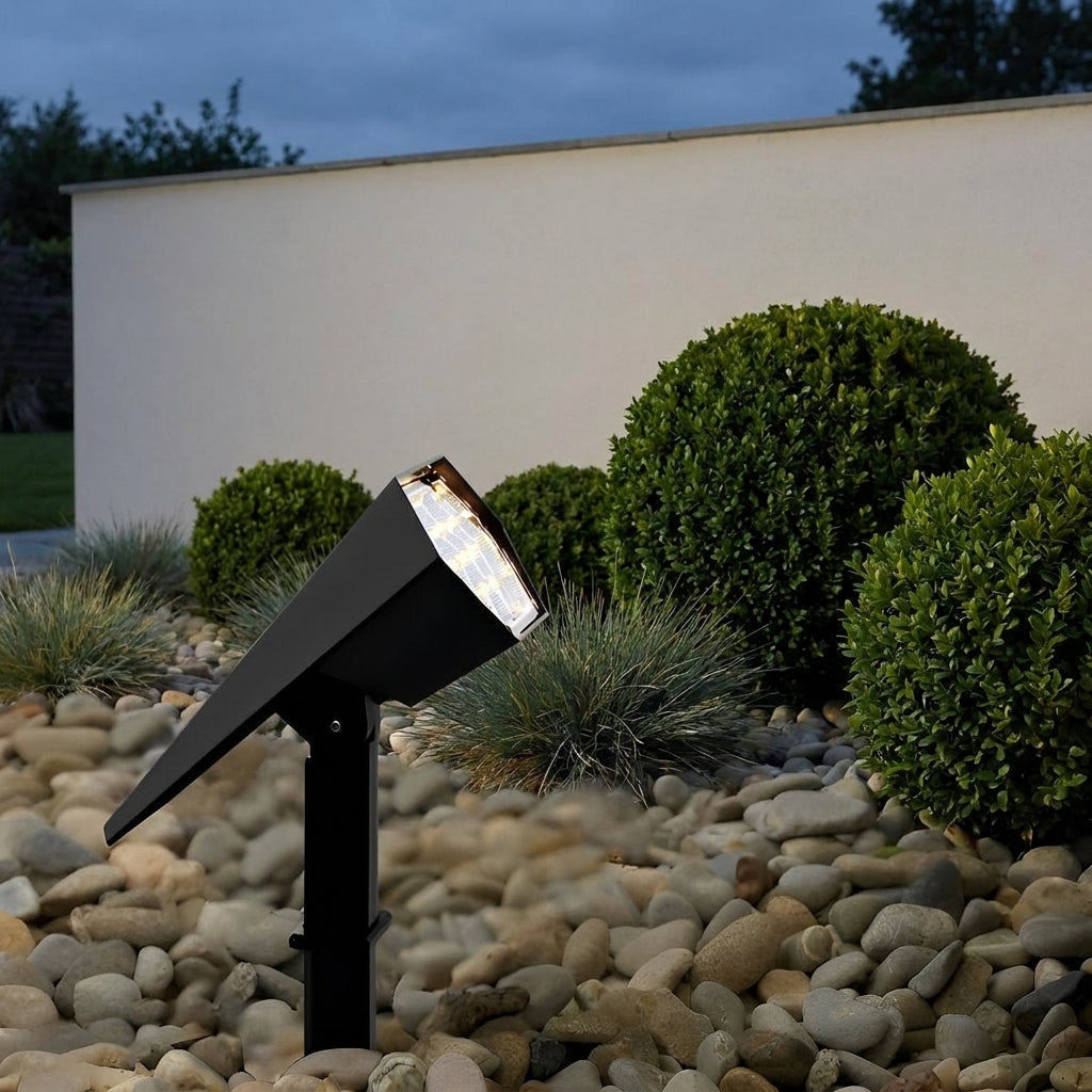 Adjustable Solar Garden Spotlight – lit amid pebbles and clipped box hedges