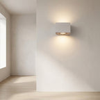 Concrete Outdoor LED Wall Light – mounted on a hallway wall beside a window