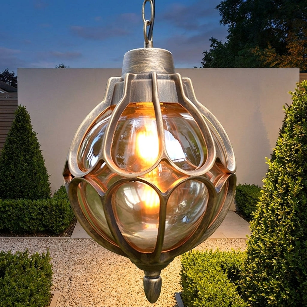 Outdoor Glass Globe Pendant Light – close-up lit against a garden wall