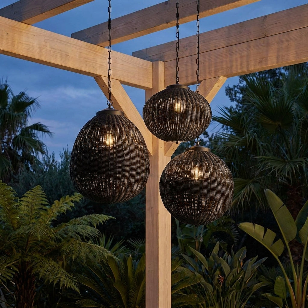 Black Rattan Outdoor Pendant Lantern – trio hanging from a pergola beam among palms