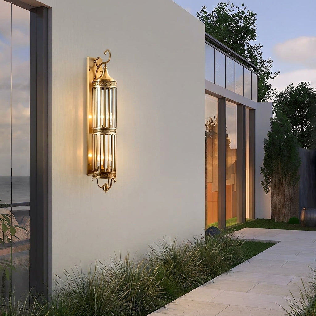 Mid Century Copper Outdoor Wall Lantern – mounted beside glass doors under a porch at dusk