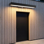 Rectangular Motion Sensor Outdoor Wall Light – mounted above a door on timber cladding