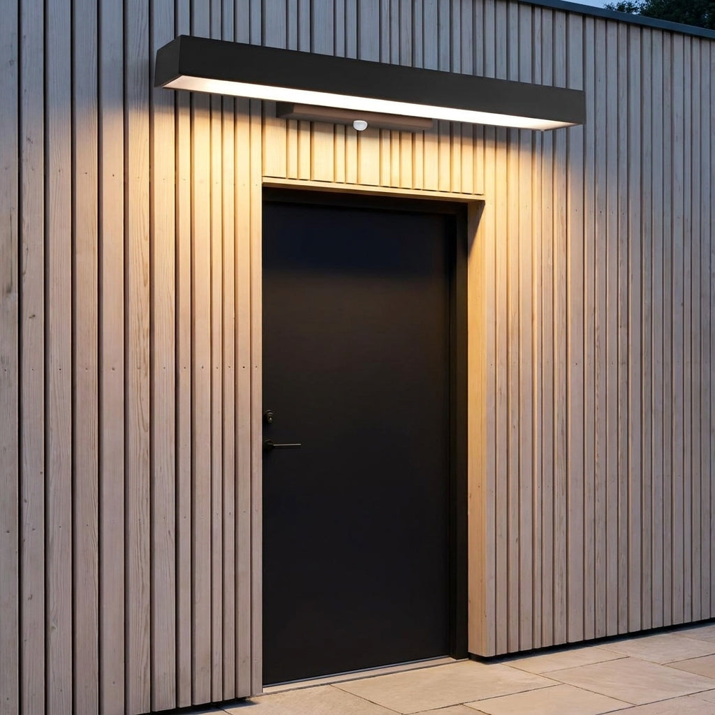 Rectangular Motion Sensor Outdoor Wall Light – mounted above a door on timber cladding