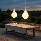 Water Drop Outdoor Pendant Light – two pendants lit above a candlelit dining table