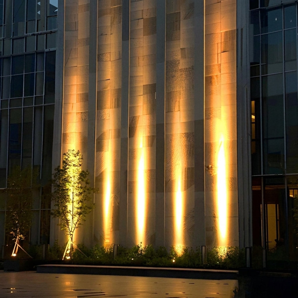 High Output Outdoor LED Spotlight – building facade uplighting beside a tree at night