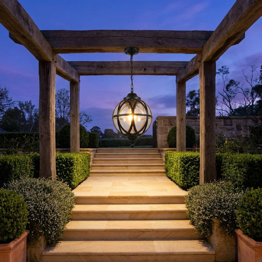 Outdoor Glass Ball Chandelier – hanging over stone steps in a garden at dusk