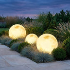 Solar Moon Ball Garden Lights – three moon lights among ornamental grasses at dusk