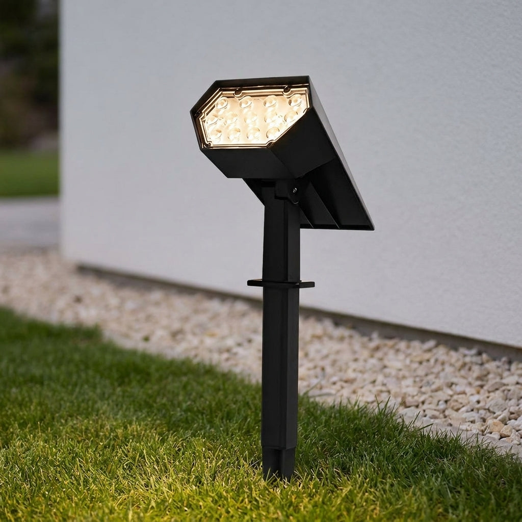 Solar LED Landscape Spotlight – close-up on a lawn, lit at dusk