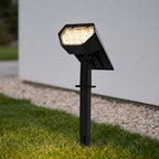 Solar LED Landscape Spotlight – close-up on a lawn, lit at dusk