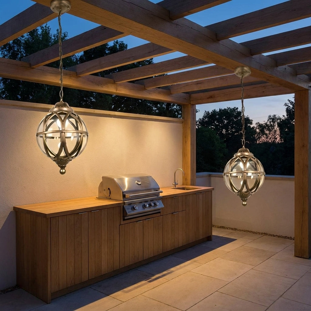 Outdoor Glass Ball Chandelier – two lanterns hanging over an outdoor kitchen at dusk
