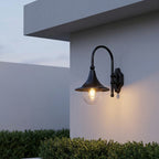 Farmhouse Horn Outdoor Wall Light – on a gable wall above shrubs at dusk