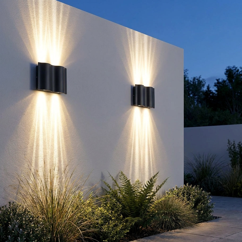 Black Up & Down Outdoor Wall Light – pair up and down lit above ferns