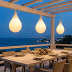 Water Drop Outdoor Pendant Light – lit pendants above an outdoor dining table