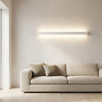 Wooden Up & Down LED Wall Light – lit above a sofa in a living room