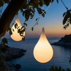 Water Drop Outdoor Pendant Light – lit pendant hanging among tree branches at dusk