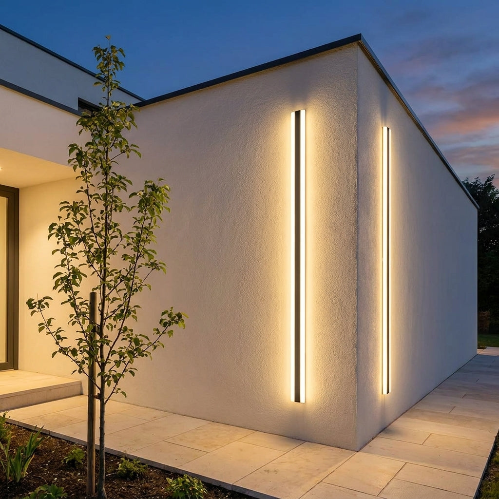 Solar LED Strip Porch Wall Light – lit on a house corner beside a young tree