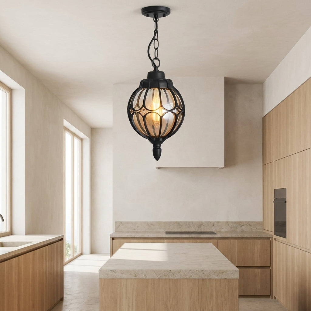 Outdoor Glass Globe Pendant Light – black finish hanging in a modern kitchen