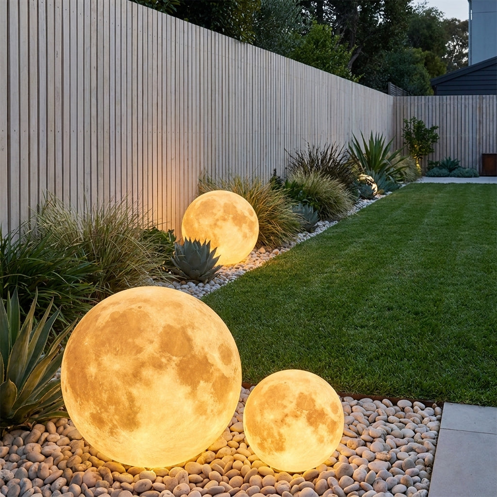 Solar Moon Ball Garden Lights – three moon lights among rocks and grasses