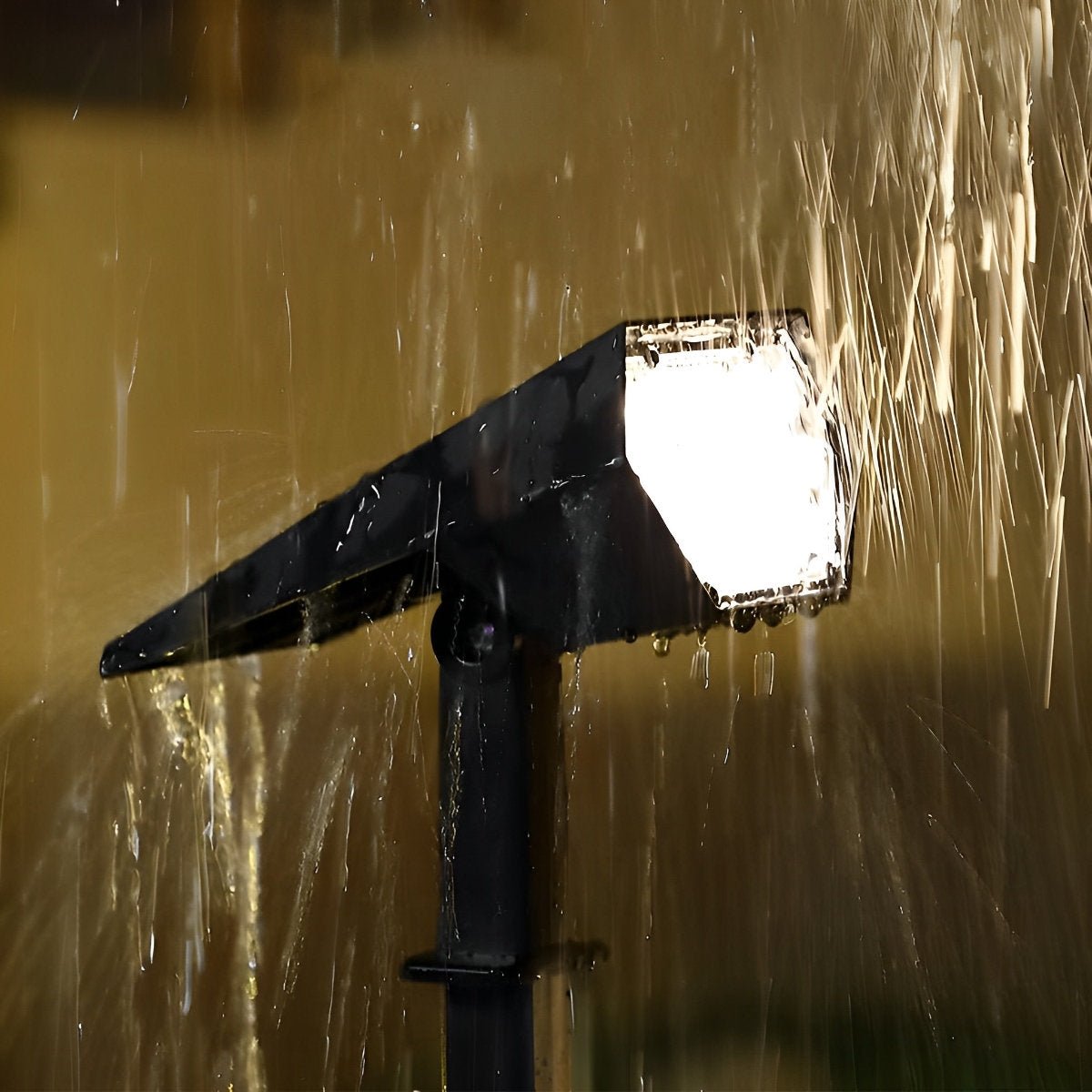 Adjustable Solar Garden Spotlight – waterproof spray test in low light