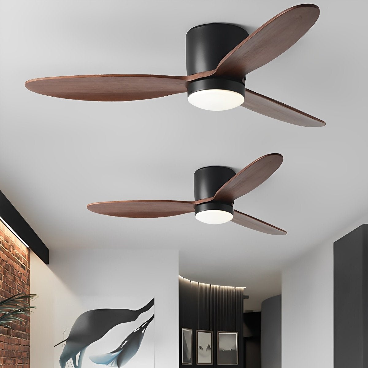 Low Profile DC Ceiling Fan with LED Light – two fans in matte black with walnut blades in a hallway