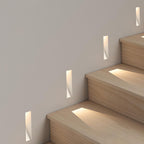 Recessed Motion Sensor LED Wall Light – recessed lights lit beside pale wooden stairs