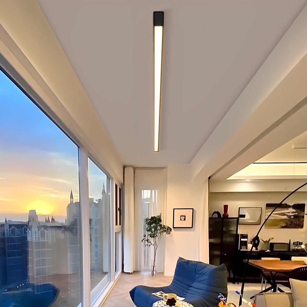 Slim Dimmable LED Linear Ceiling Light – lit above a lounge at sunset, city view