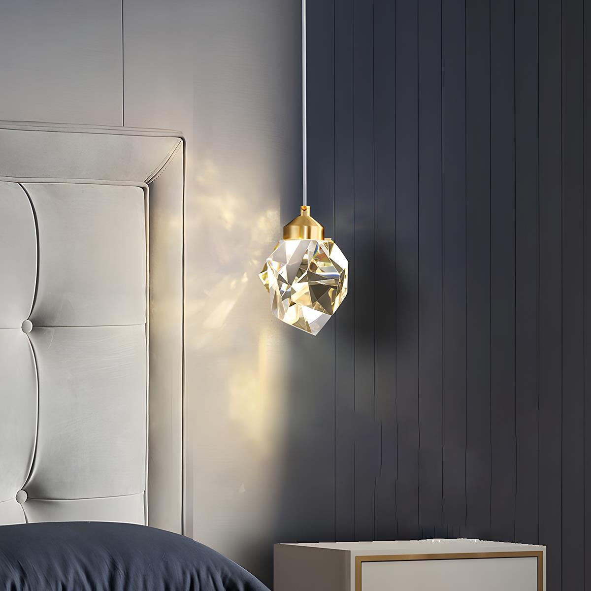 Brass & Crystal Dimmable Pendant Light – faceted crystal pendant beside a bed at night