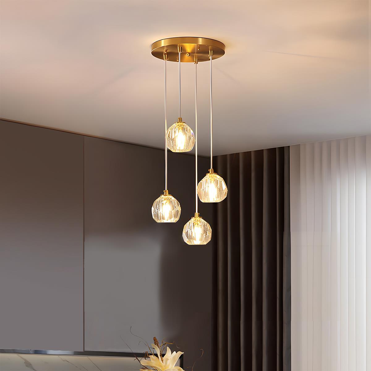 Brass & Crystal Dimmable Pendant Light – four round crystal pendants clustered below the ceiling