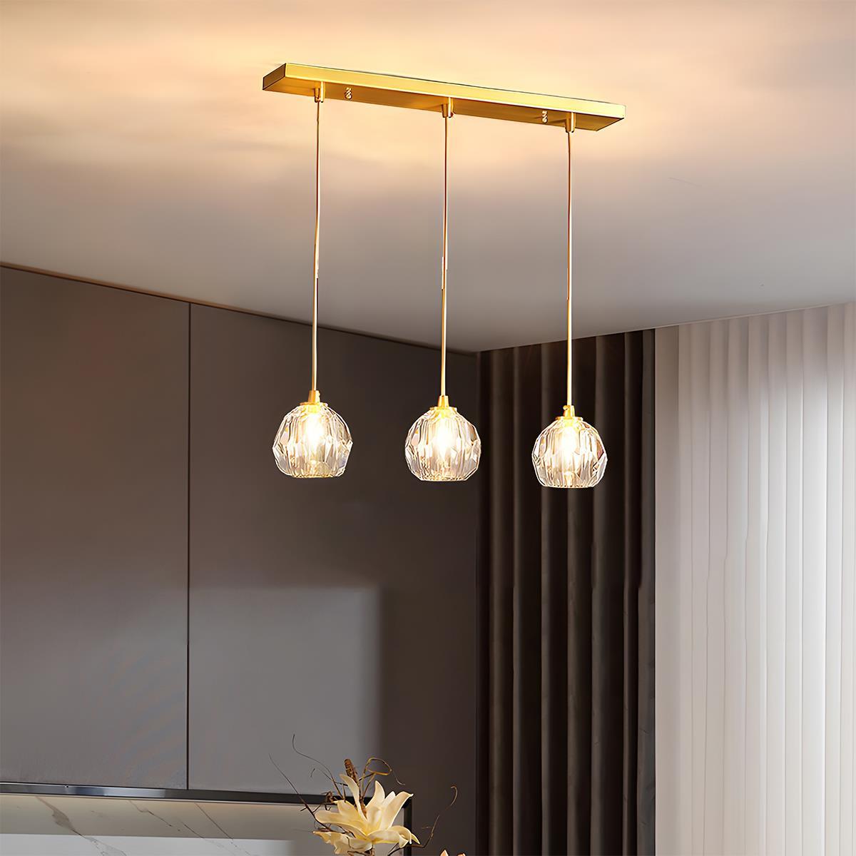 Brass & Crystal Dimmable Pendant Light – three round crystal pendants on a linear bar