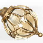Outdoor Glass Globe Pendant Light – close-up of the brass finish, white background