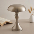 Rune Table Lamp – nickel finish on a table beside a book